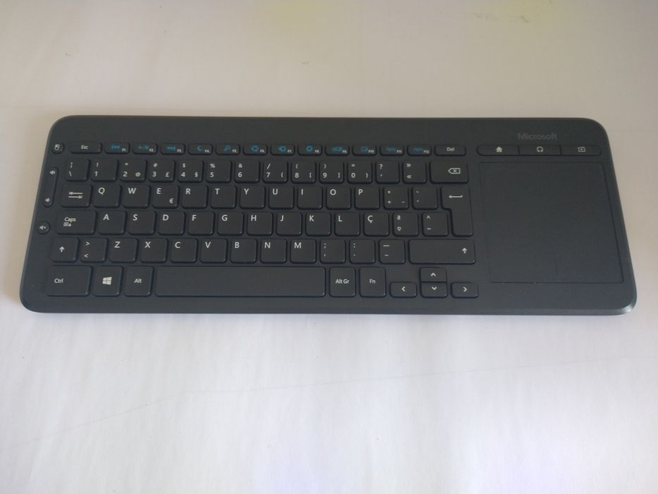 Teclado Microsoft com Touchpad498975297923993600