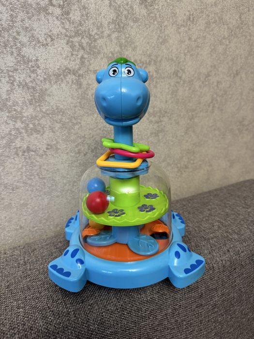 Дитяча дзига-юла бегемот з кульками