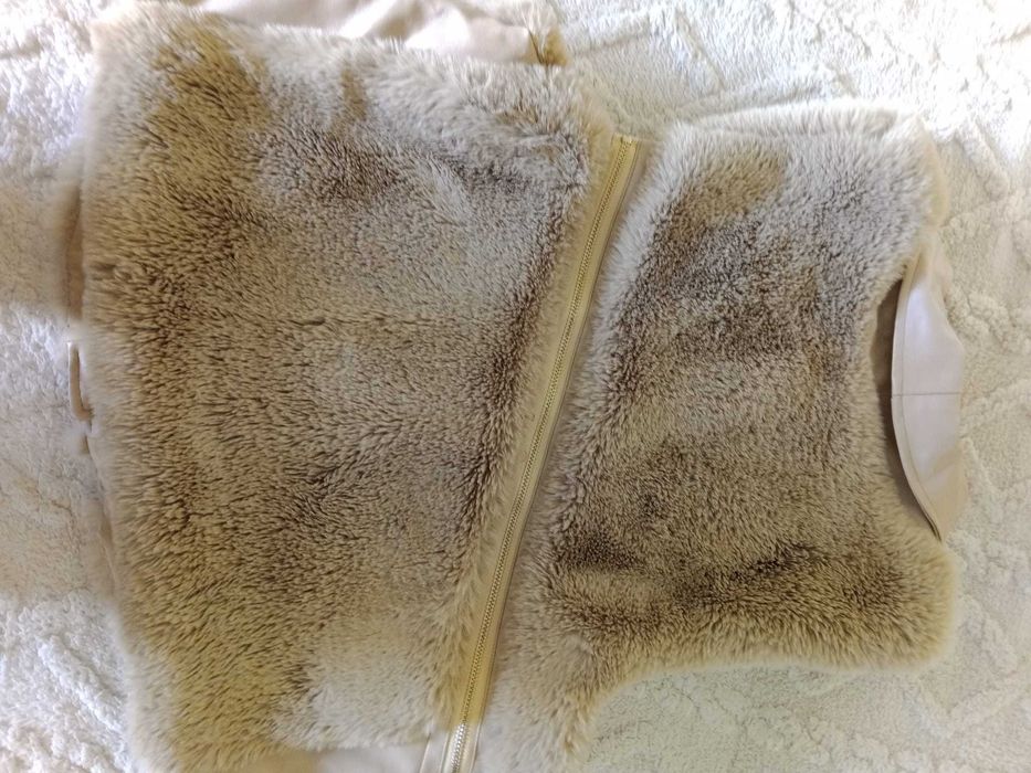 Colete You e Me Paris, muito bem cuidado.