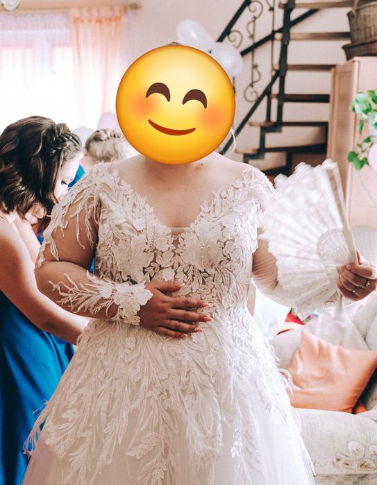 Suknia ślubna długi rękaw piórka