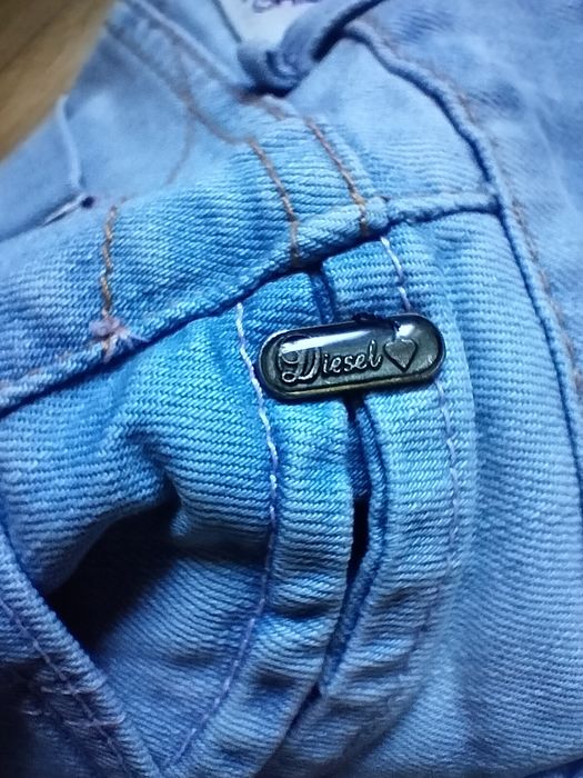 DIESEL spodnie damskie jeansy slim 
DIESEL Roxanne