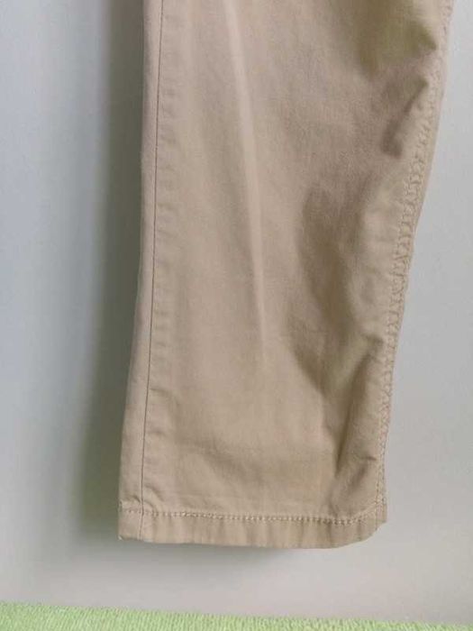 Długie spodnie beżowe lekkie przewiewne wiosenne letnie Next 122 7 lat