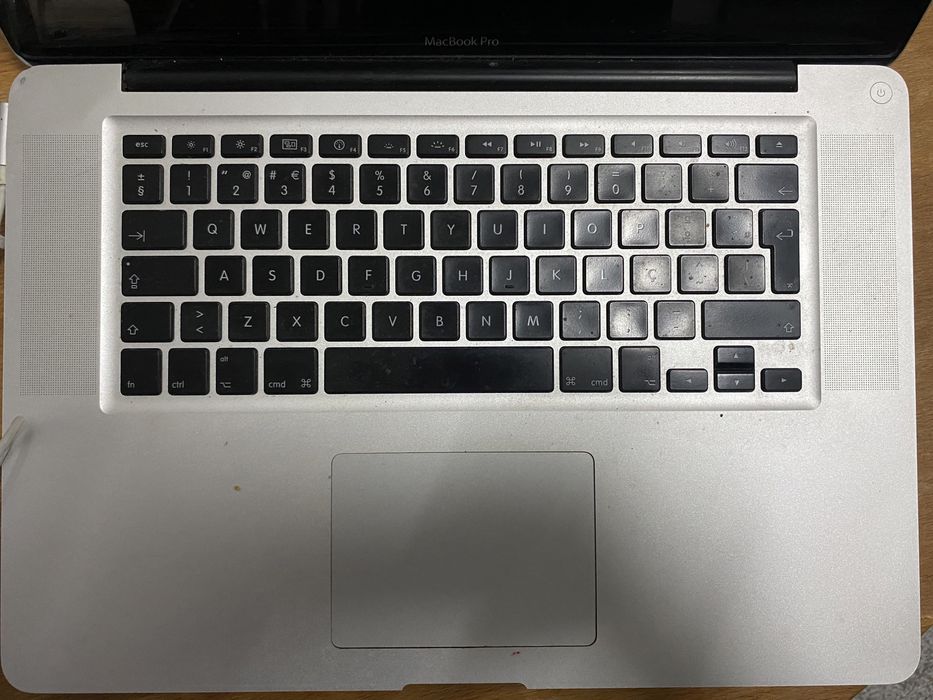 Macbook Pro for parts + charger64585249955202121