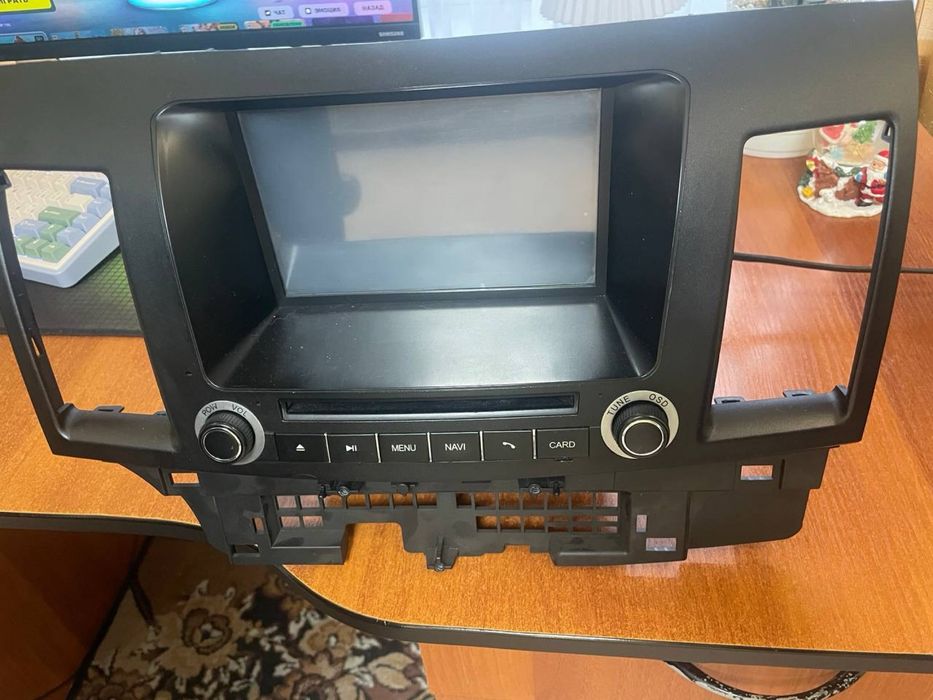 Продам магнитолу Mitsubishi Lancer