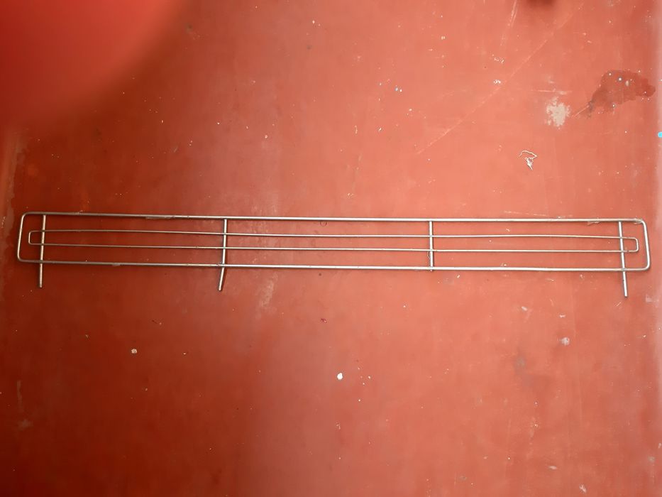 Обмежувач полиц, стелажів