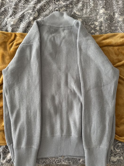Cardigan de malha com fecho da Maison Margiela.