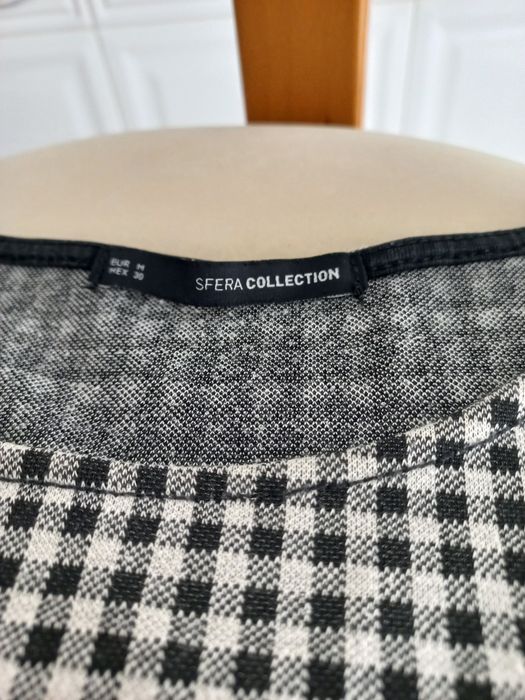 Blusa em xadrez da SFERA Collection
