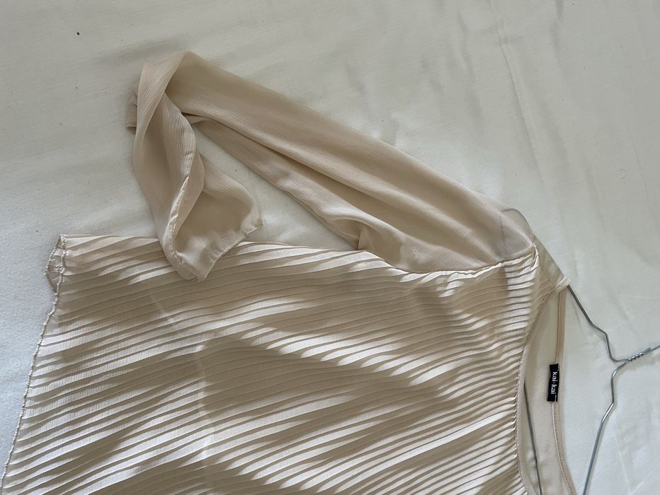 Blusa assimetrica plissada