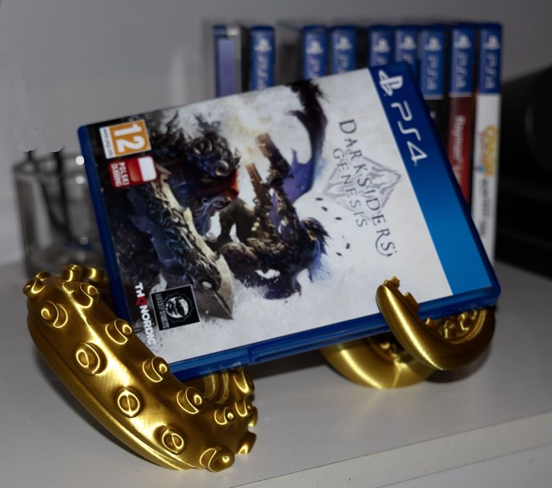 Stojak na pad i pudełko używanej gry  unikatowy od PlayStation do Xbox