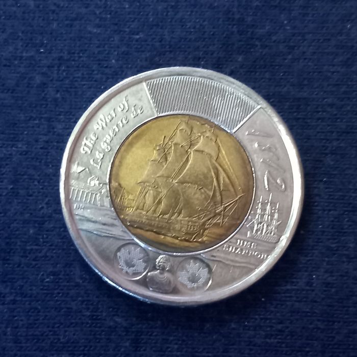 Moedas dólar Canadá e liras Itália