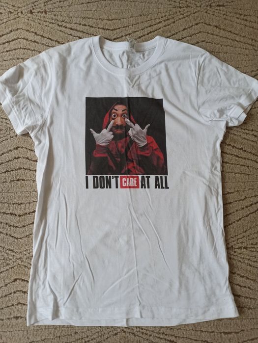 Biały t-shirt oversize z nadrukiem dom z papieru S M 36 38