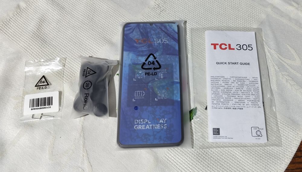 TCL305  com fones incluídos