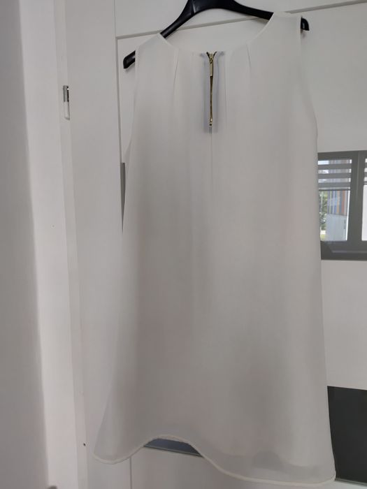 Elegancka  zwiewna sukienka kremowa