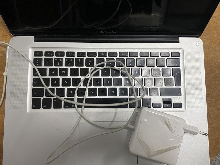 Macbook Pro for parts + charger64585249955202122