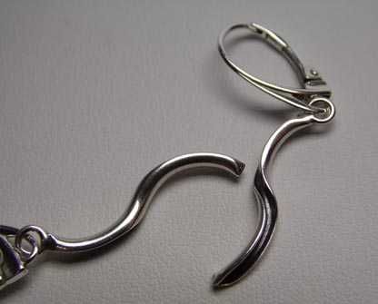 Srebrne wiszące kolczyki wywijane rurki wewnątrz oksydowane