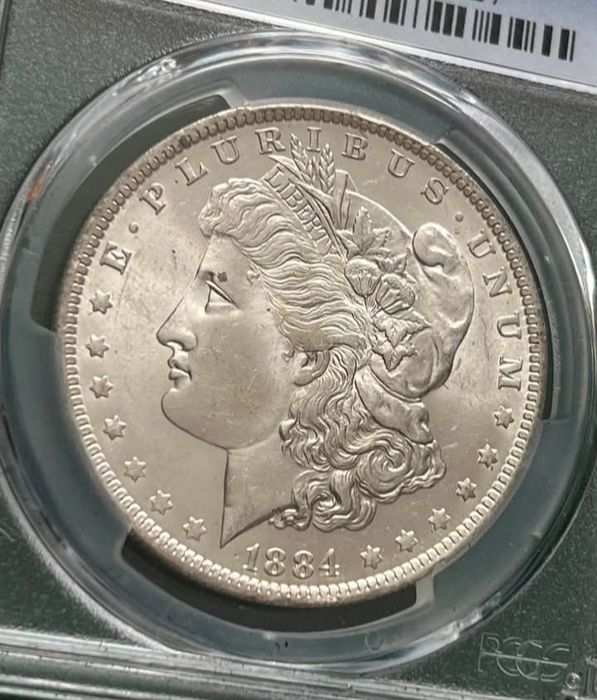 Долар 1884 року Моргана,Новий Орлеан в слабі  PCGS MS 63