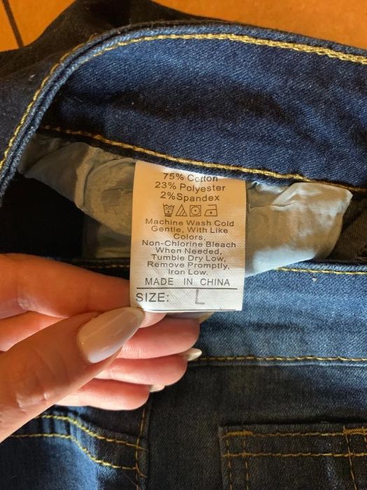 Spodnie z dziurami przecieranie jeansy granatowe damskie 40 L