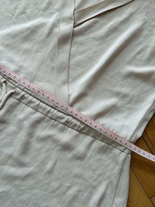 Damski kremowy kombinezon