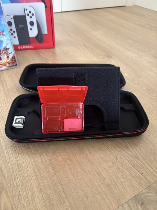 Nintendo switch oled + bolsa de transporte + jogo