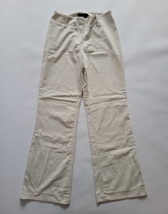 Kremowe spodnie dzwony flare bootcut niski stan biodrowki 34 XS