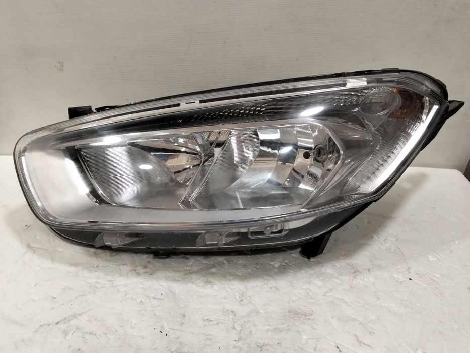 Farol Ford Transit Courier ótica 2015 esquerdo