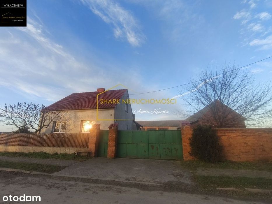 Dom z budynkami gospodarczymi i ziemią rolną