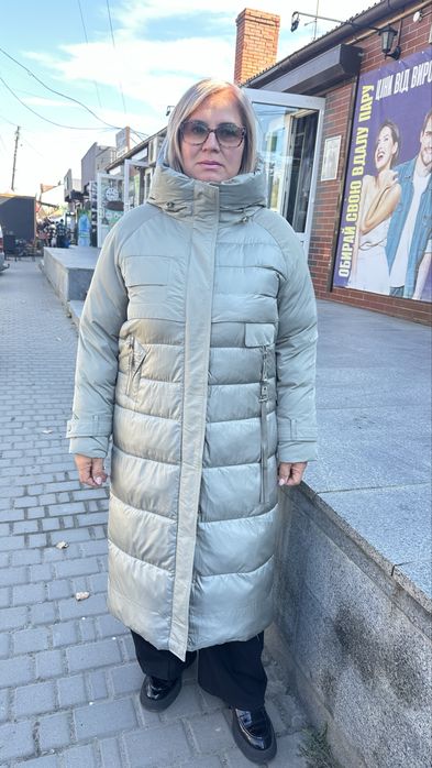 Оливковий пуховік хл стан нового