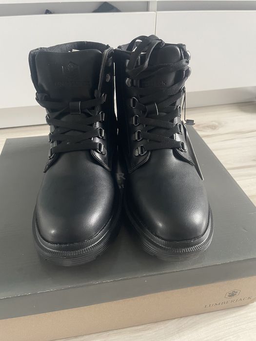 Lumberjack woman black boots winks