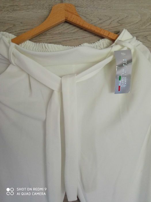 Spodnie materiałowe, ecru. Nowe.