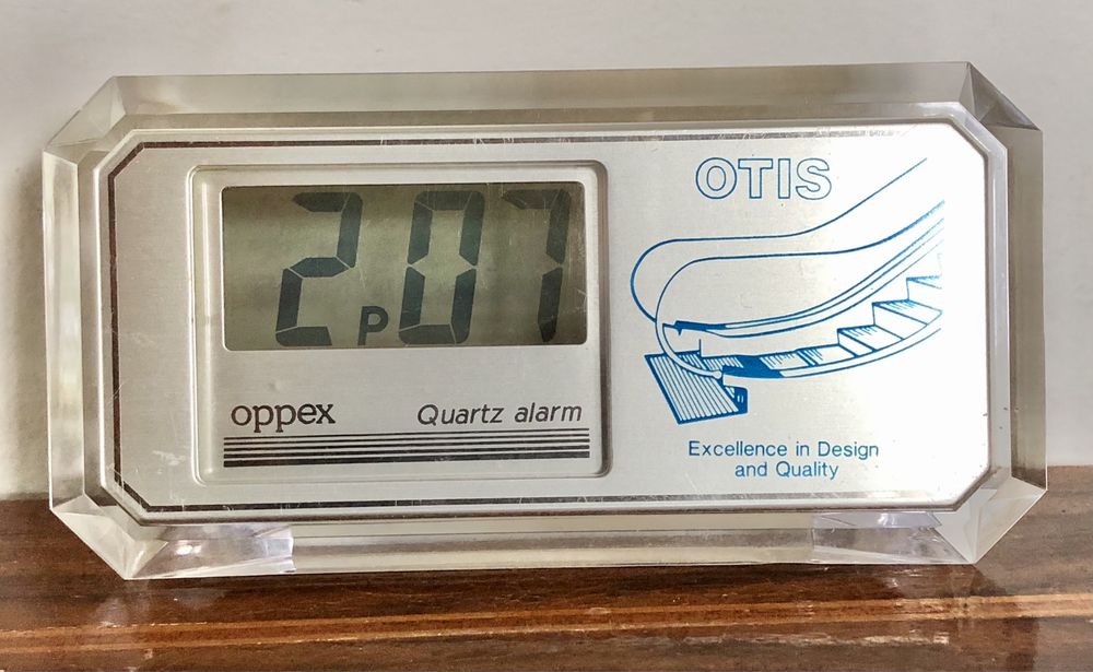 Retro zegarek budzik LCD kwarcowy Oppex reklama OTIS przeźroczysty vtg
