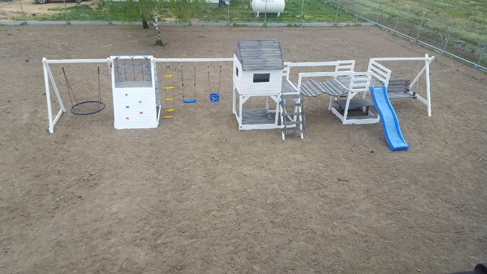 Plac zabaw stolik bocianie gniazdo wspinaczka hustawka transport