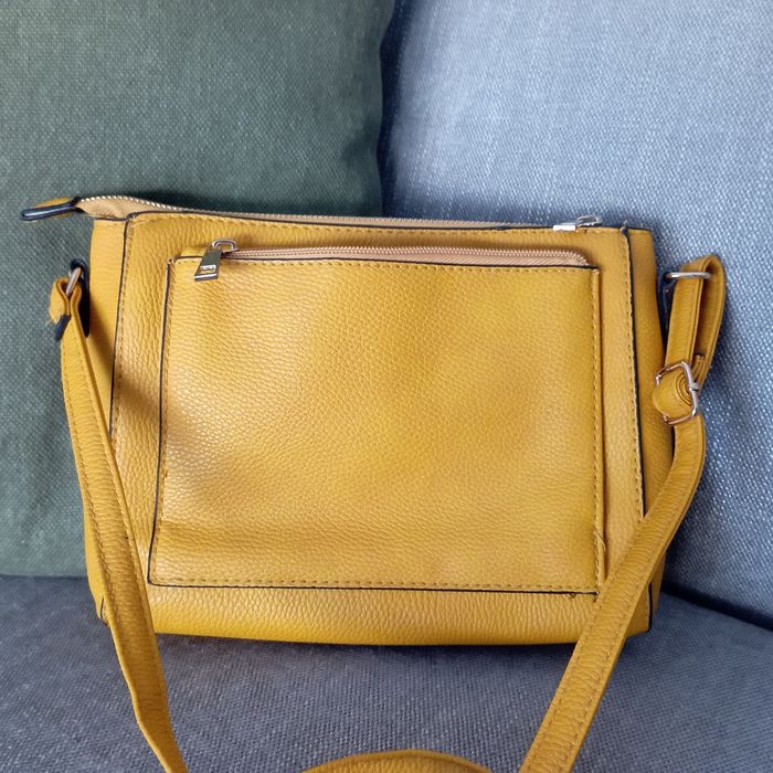 Slightly used yellow suitcase