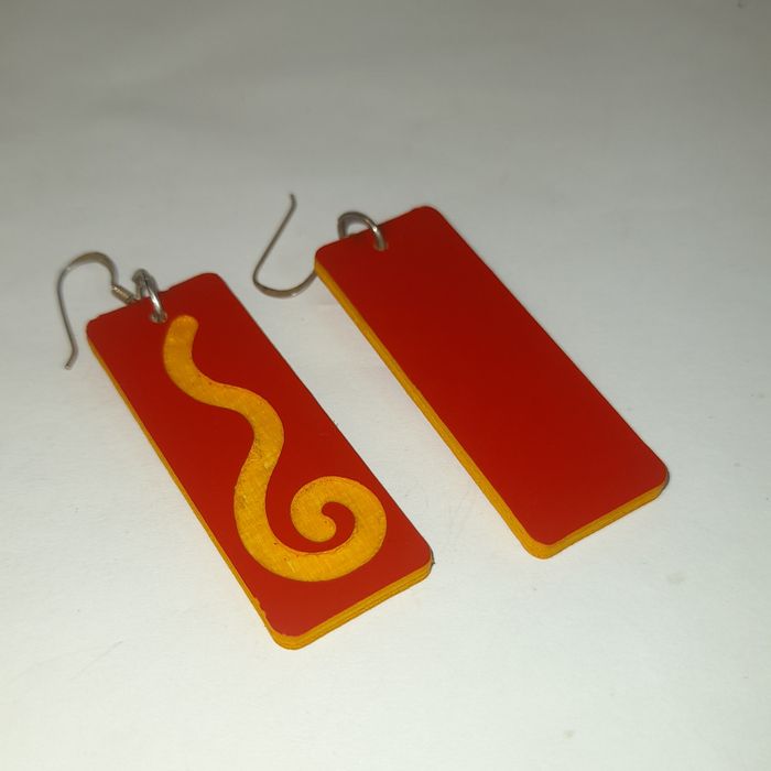 Wooden earrings in the shape of spirals.