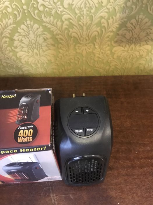 Обогреватель от розетки з цыферблатом