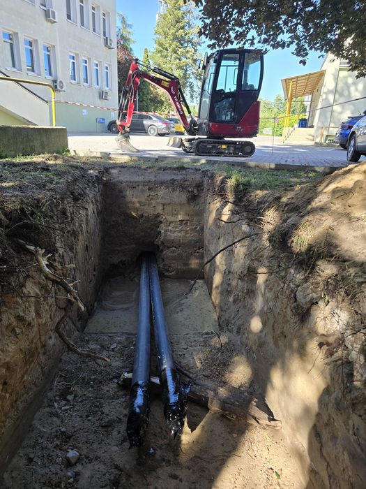 Przeciski kret wbijanie rur stalowych przewierty sterowane minikoparka