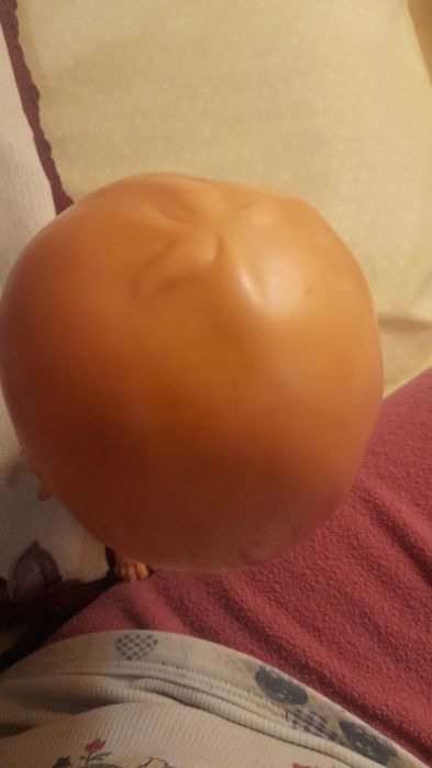 Boneca antiga de plástico