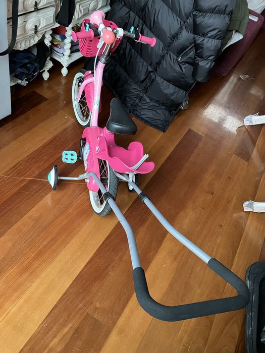 Bicicleta crianca rosa de aprendizagem