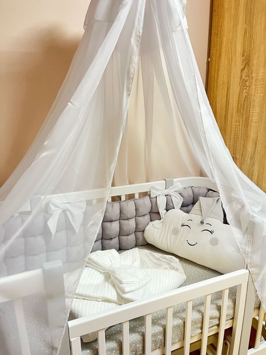 Дитяче ліжечко з маятником