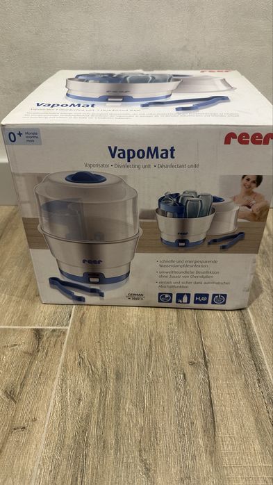 Паровой стирилизатор  бутылочек reer