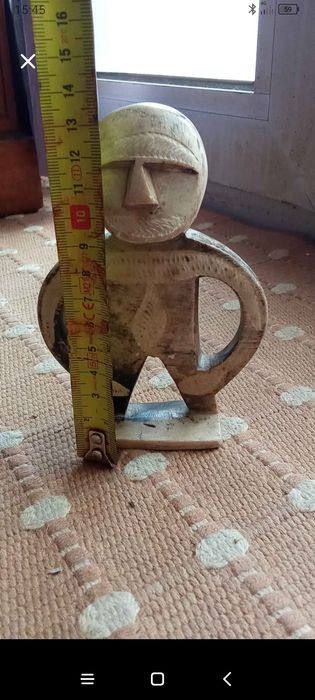 Boneco de pedra para enfeitar