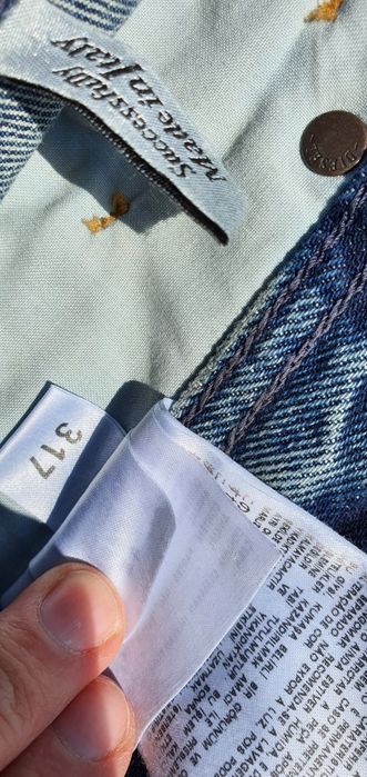 Spodnie jeans jeansowe Diesel oryginalne z dziurami Rozmiar 32