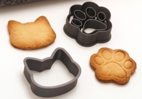 Forma de bolachas em forma de pata e cara de gato
