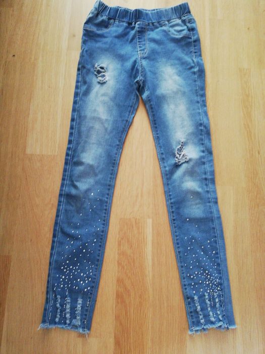 Spodnie 12 lat dla dziewczynki jeansy z dziurami