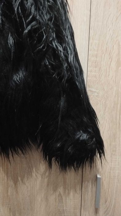 Casaco de pelo preto