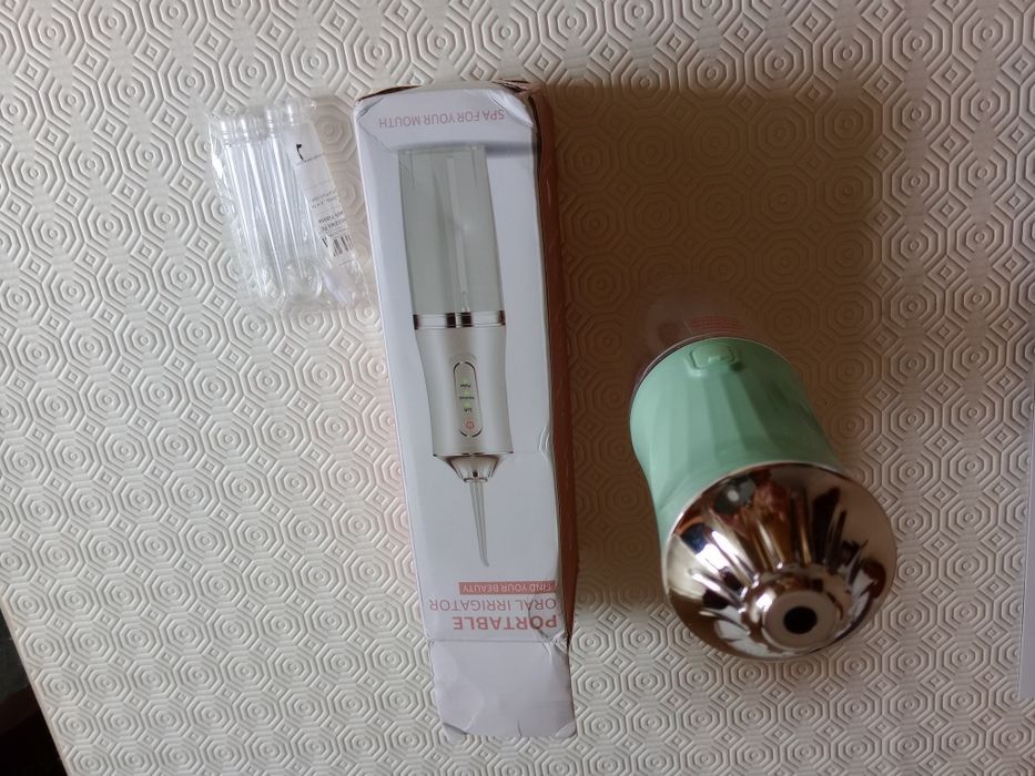 Irrigador bucal dentário