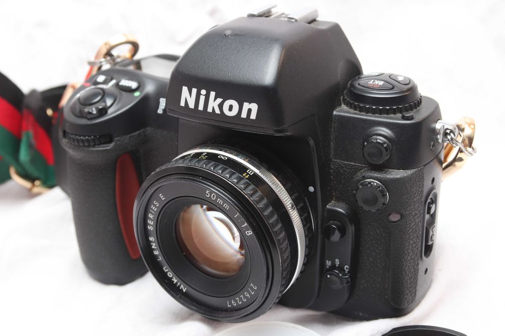 Nikon F100 + Nikon 1.8/50 E Series Stan idealny!