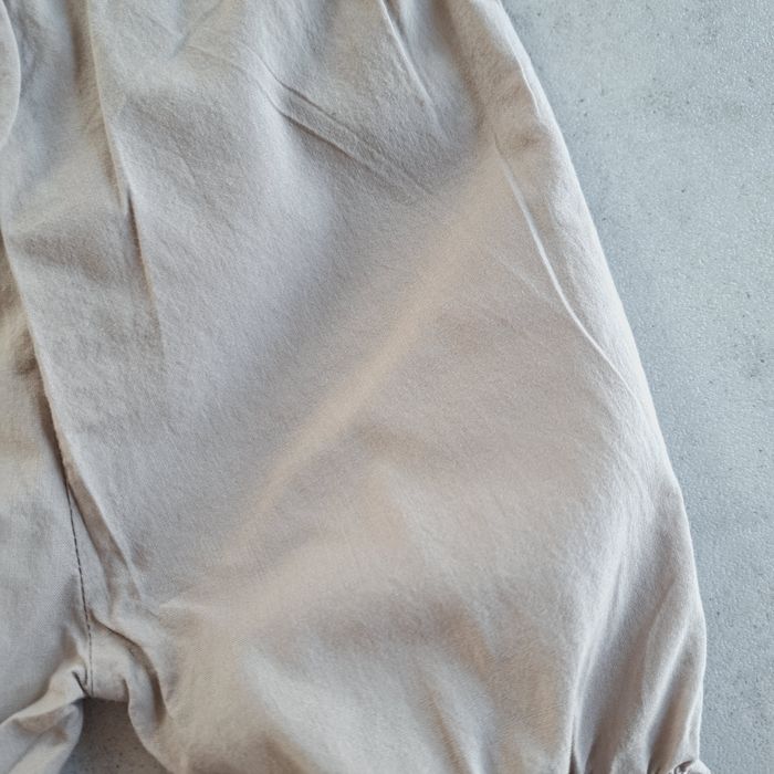 Spodenki z falbanką bloomersy Newbie KappAhl beżowe