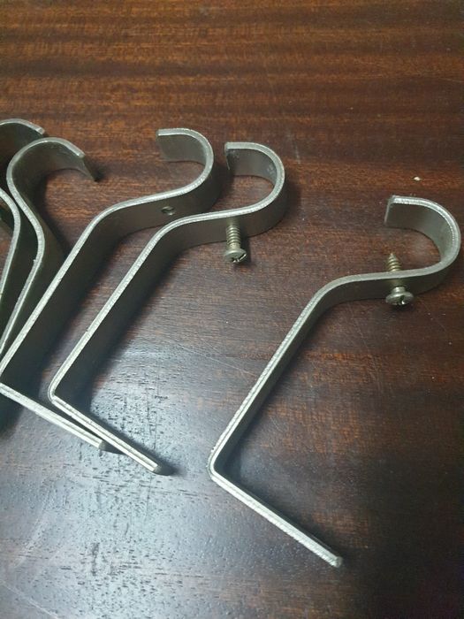 Suportes para varões de cortinados