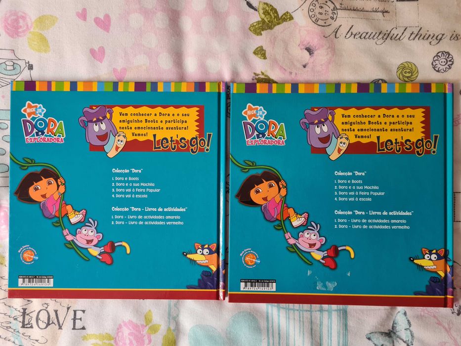 2 livros infantis da coleção "Dora a Exploradora"
