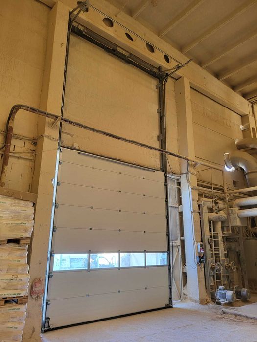 Naprawa uszkodzonej zerwanej pękniętej sprężyny linki bramy garażowej